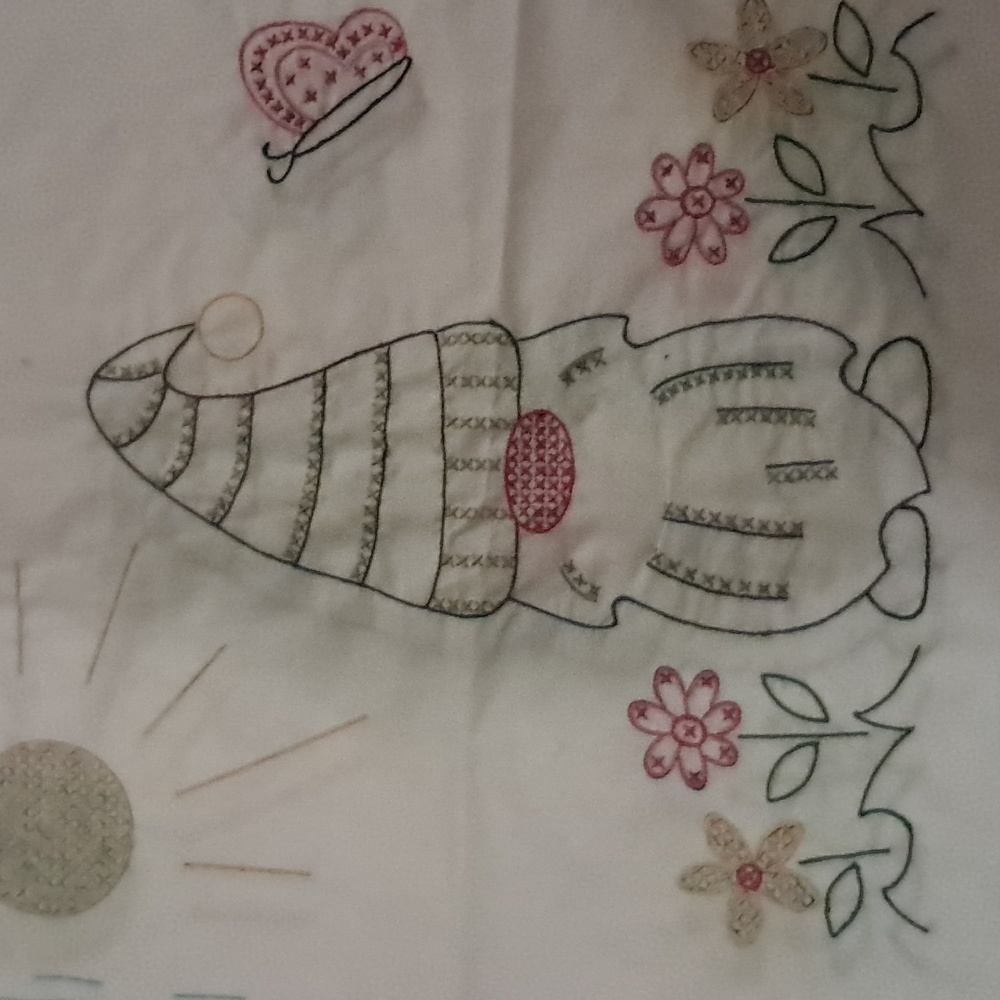 Hand embroidered quilt squares